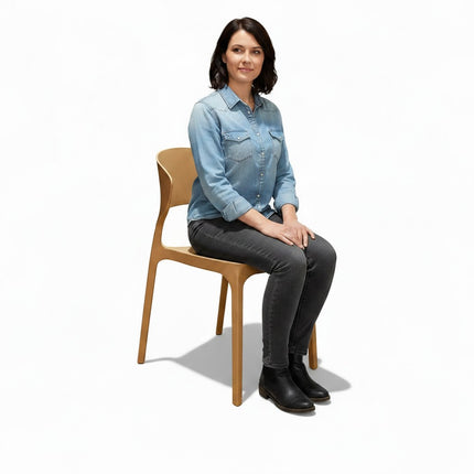 Gharnish Astra tan PVC chair with a modern, curved design and ergonomic seating. Ideal for cafes and restaurants.