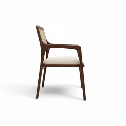 Gharnish Vanya Teakwood Cane Chair with a rich brown finish and natural cane backrest and seat.